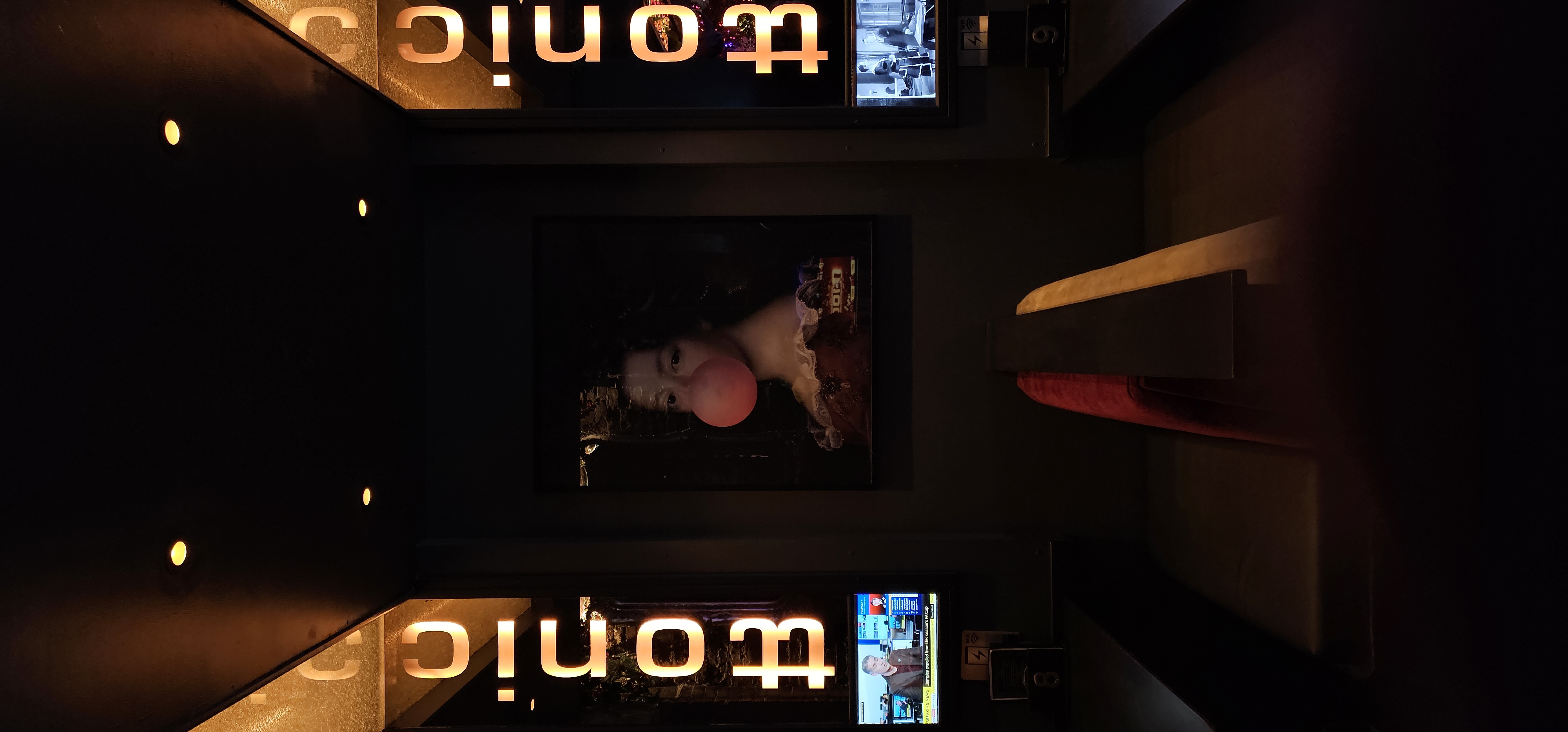 Bubblegum portrait and illuminated wall details inside Ttonic