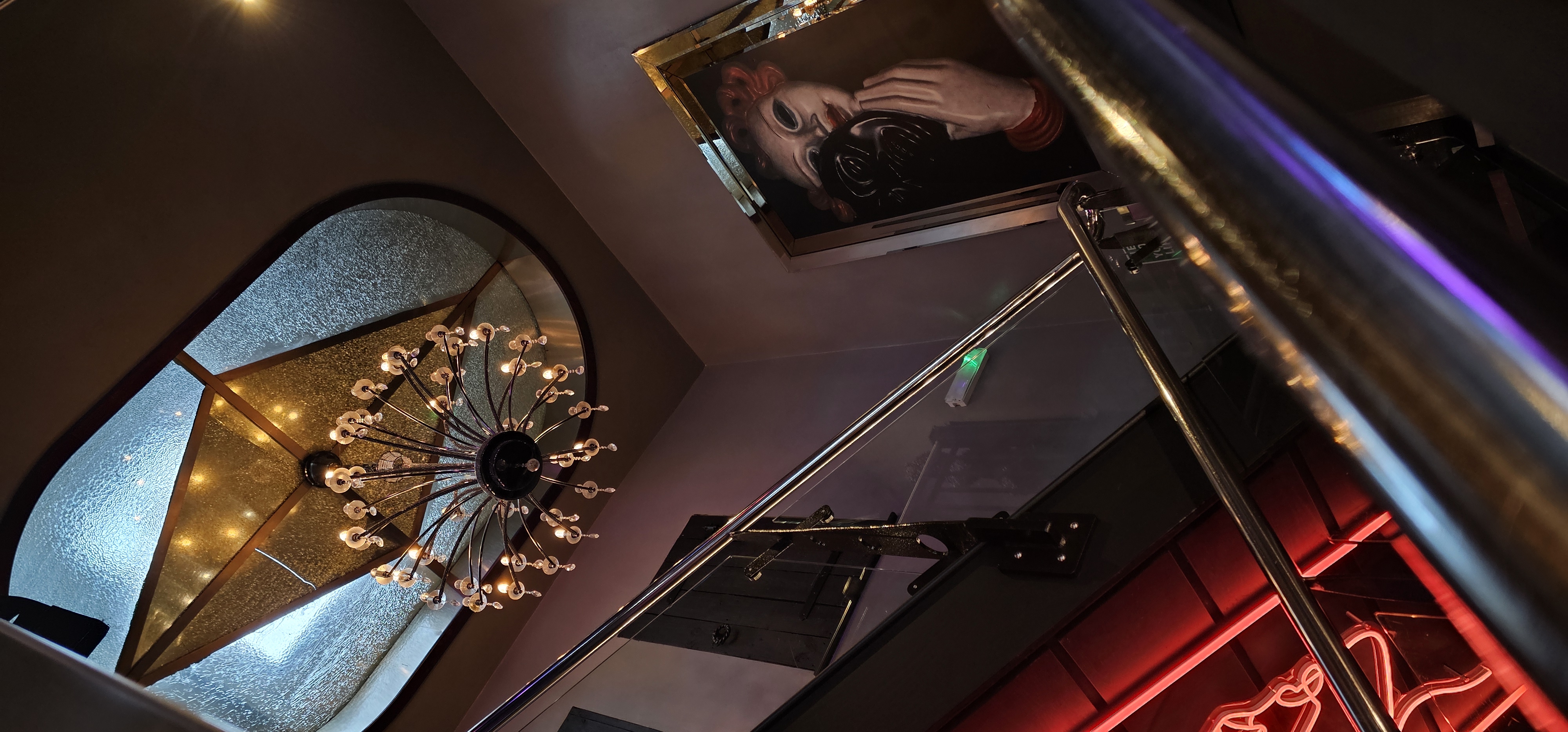 Chandelier and illuminated entrance details inside Ttonic